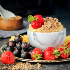 Creamy Chocolate English Toffee Fruit Dip on dark background