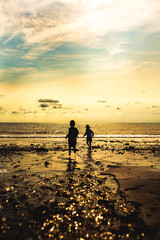 Silhouette of children on a beach