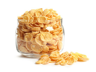 Jar with crispy cornflakes on white background