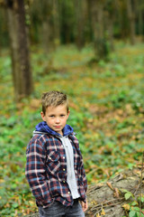 Enjoying autumn time. Little boy on autumn landscape. Little child walk in autumn forest. Small boy play on fresh air. Fall days are fun days