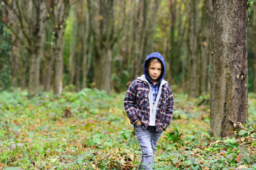 Small hipster. Small boy travel in autumn woods. Small boy look more hipster than homeless. Because...