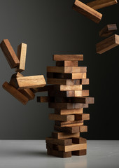 wood jenga game business concept risk strategy fall down
