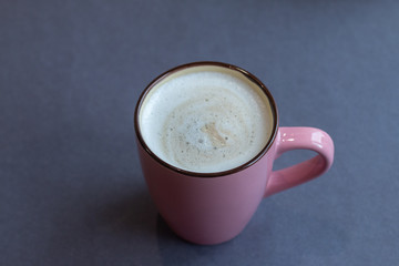 cup of coffee on grey background
