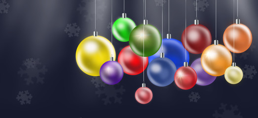 Christmas background with colored balls on dark background.