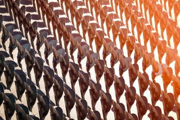 Fototapeta premium Pattern of metal folding chairs standing in line