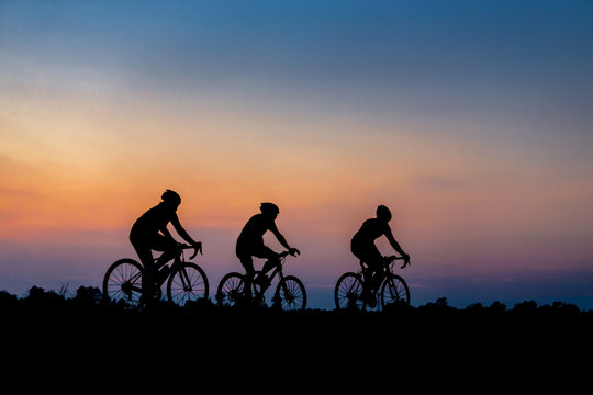 Silhouette of cyclist on the background of beautiful sunset