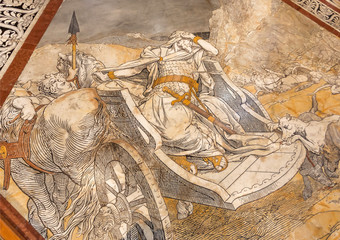 Historical scene with rider on a wagon on marble mosaic floor of 14th century Duomo di Siena. Masterpiece artwork details of italian cathedral, UNESCO World Heritage Site
