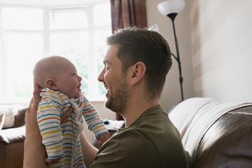 Father Making His Baby Laugh