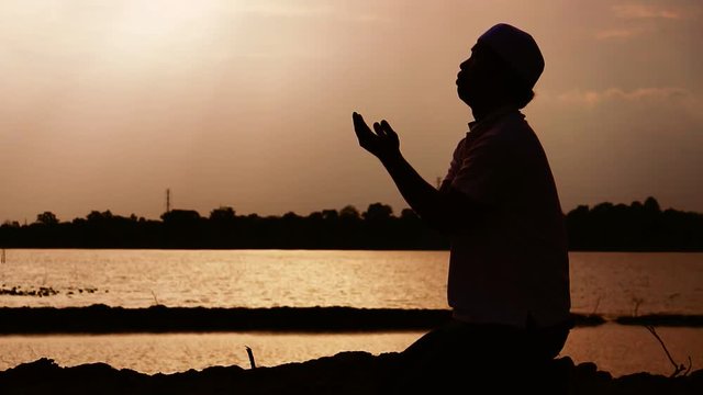 Muslim men are praying for blessings from God footage slow motion