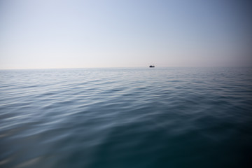 Fototapeta premium Lonely boat in the sea