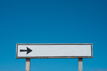 Empty white sign isolated on blue sky  