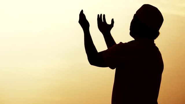 Close-up: Muslim men are praying for blessings from God footage slow motion