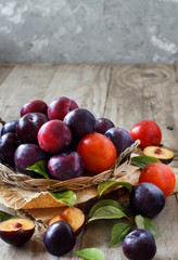 Fresh plums with leaves