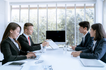 Young business people are presented marketing work project to the customer in meeting room office