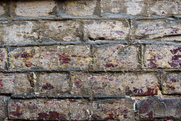 Naklejka premium Old wall of red and white bricks. Background and texture