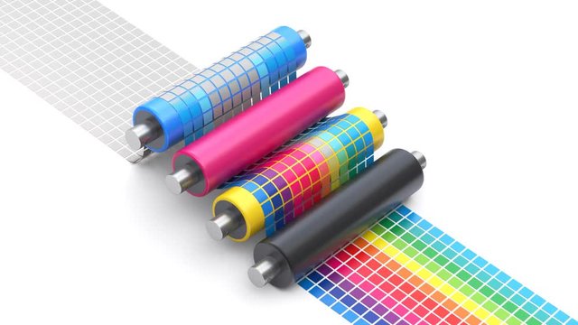 CMYK printing concept process with set of printer rollers and color chart