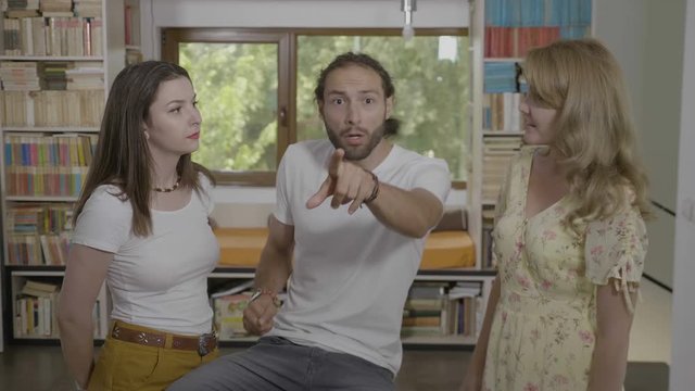 Teenage friends suddenly having shocked and panic reaction being afraid by something weird and scary