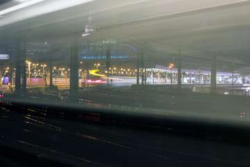 Night traffic lights with tracer, Cologne, Germany. Abstract Light Bokeh Background. Tracers passing trains.