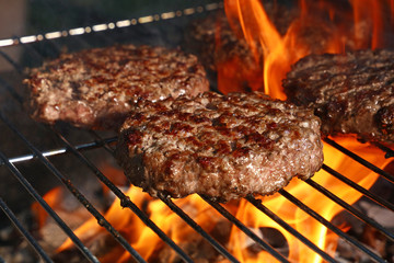 Beef burger for hamburger on barbecue flame grill - obrazy, fototapety, plakaty