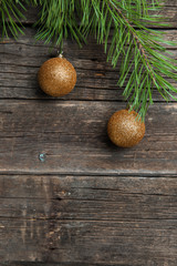 Yellow Christmas balls on wooden background
