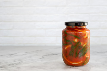 homemade green onion kimchi in a glass jar