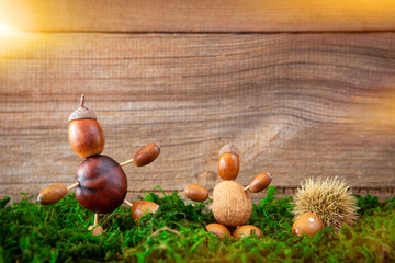 autumn tinker figures on wooden background