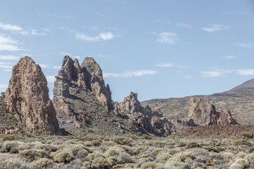 Fototapeta premium Group of large lava rocks in the middle of a special desert landscape, on a nice sunny day