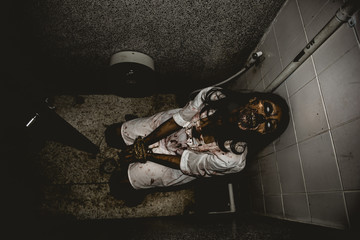 Portrait of asian woman make up ghost face with blood,Horror scene,Scary background,Halloween...