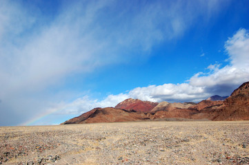 Fototapeta na wymiar Rainbow after rain in Death Valley National Park, California, USA.