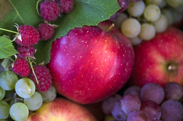 apple, raspberry, grapes close up