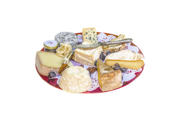 Beautiful cheese plate with various of traditional french cheeses isolated on a white background