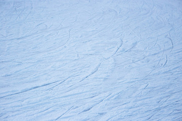 Ice rink surface abstract background with trace of skates