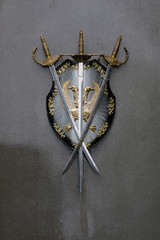 shield and sword on gray background