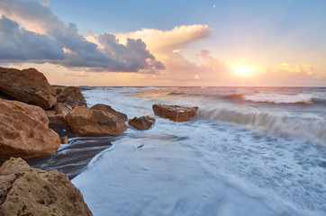 Beautiful bright sunset on the beach of Lara