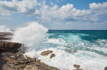 Big waves break about the Rocky Peninsula of Cape Lara in southern Akamas