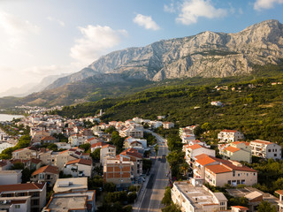 Fototapeta premium Sunset Mountain Aerial Panorama, Tucepi, Croatia - Studio Fenkoli photography by Tiina Söderholm