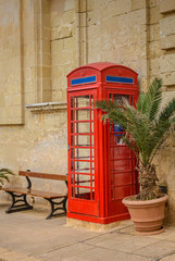 Obraz premium Red vintage telephone booth. Public telephone.English style.