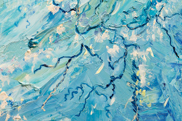Blue abstract oil painting as background. Close-up part of the oil painting "Two yellow turtles swimming in blue water".