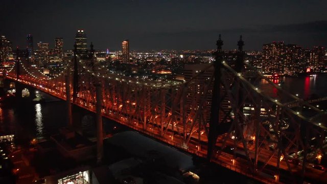 dusk orbiting Queensboro Bridge from LIC to NYC