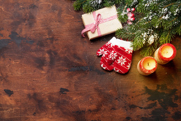 Christmas gift box, candles and fir tree branch