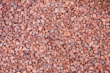 Red pebble grungy background, Close up crushed Red rock.