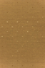 Highly detailed all over background texture of golden shape-shaped dots textile in synthetic fabric.