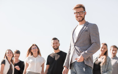 confident businessman in front of his business team.