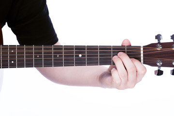 Playing on acoustic guitar close-up. Male arm guitar strings