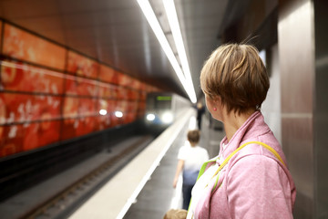 Woman on platform in subway