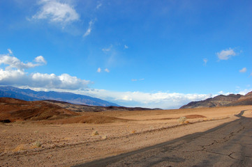 Fototapeta na wymiar Road in Death Valley National Park on cloudy, California, USA.