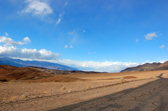 Road in Death Valley National Park on cloudy, California, USA.