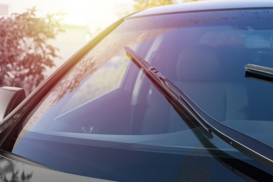 Brushes on the windshield with copy space. The concept of cleaning agent, polishing, nanocoatings