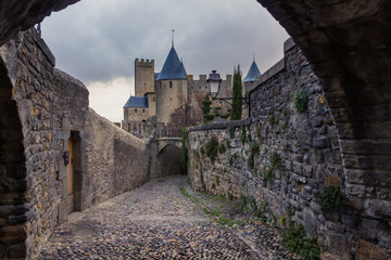 Medieval, cobblestone street in Carcassonne, the largest walled city in Europe (France)
