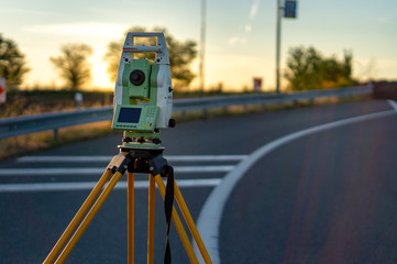 Surveyor equipment (theodolit or total positioning station) on the construction site of the...